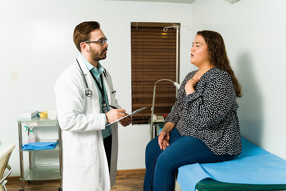 Doctor explaining risks of bariatric surgery to patient.